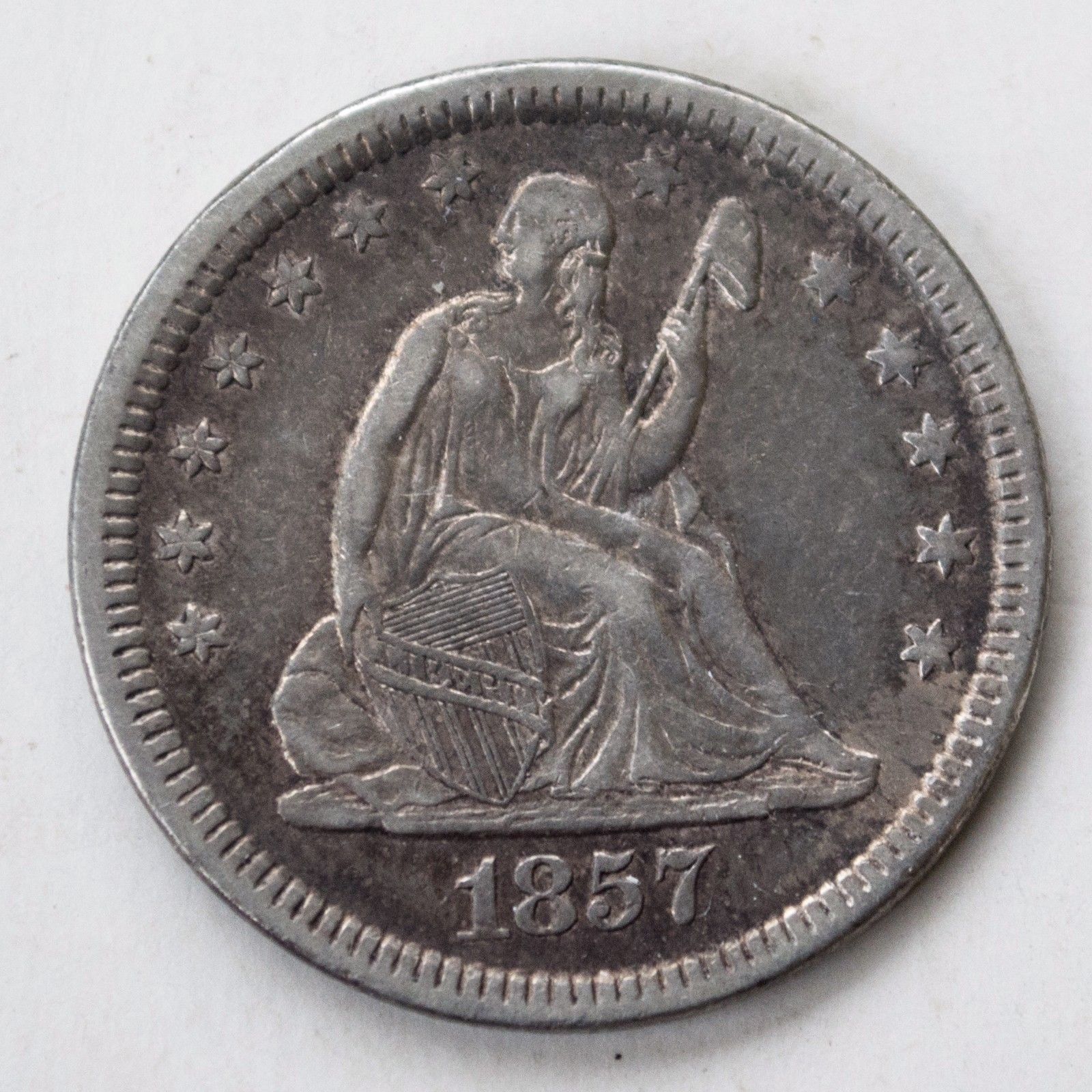 1857 Seated Liberty Quarter AU50 | Of Coins & Crystals
