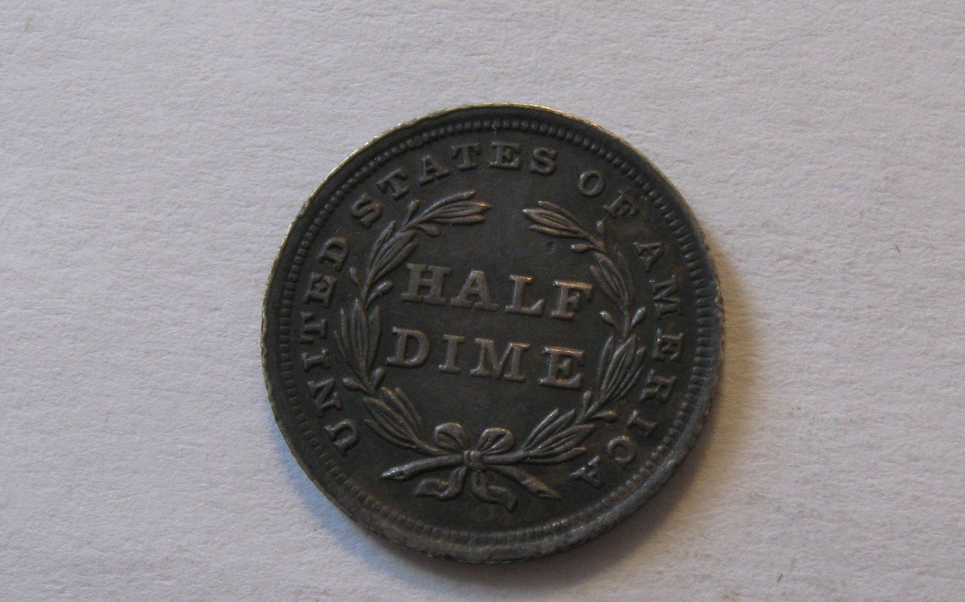 1838 Seated Liberty Half Dime, Large Stars.  AU-50 | Of Coins & Crystals