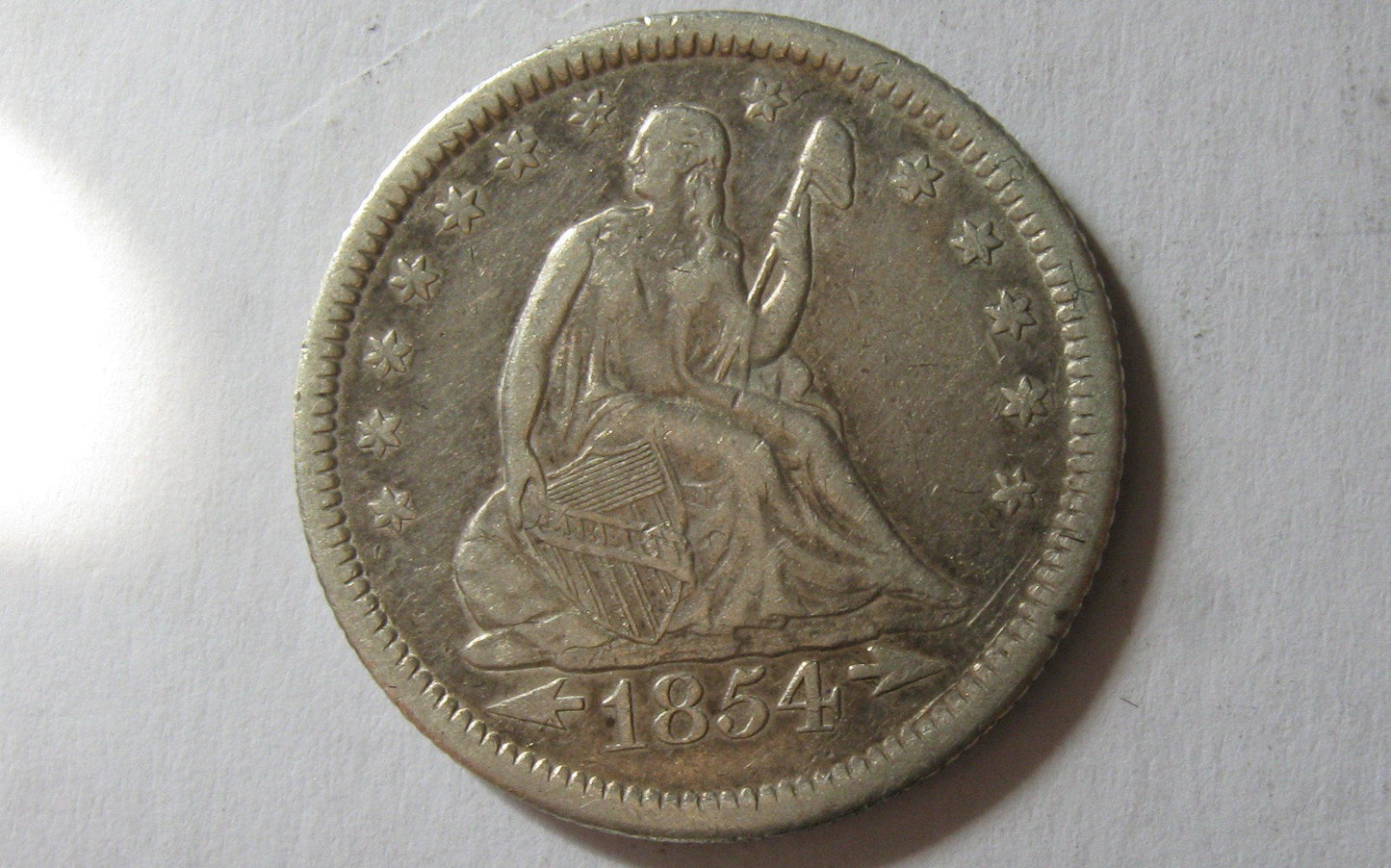 1854-O Seated Liberty Quarter.  Arrows at date.  XF-40 | Of Coins & Crystals