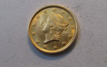 1854 Liberty Head Gold Dollar.  MS-62 | Of Coins & Crystals
