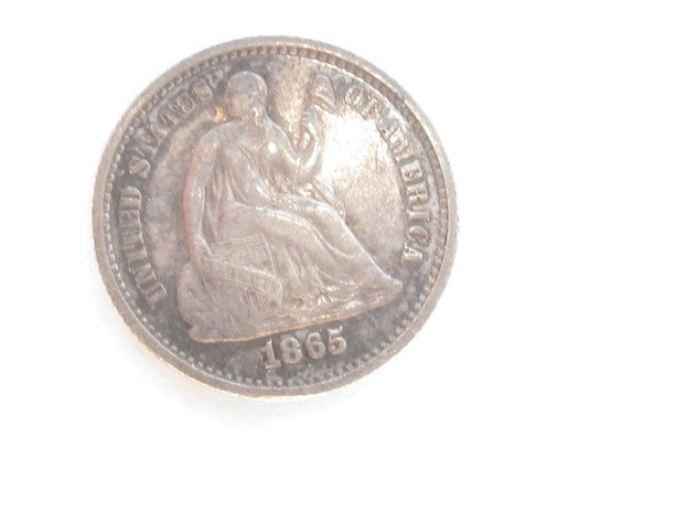 1865 Seated Half Dime about unc