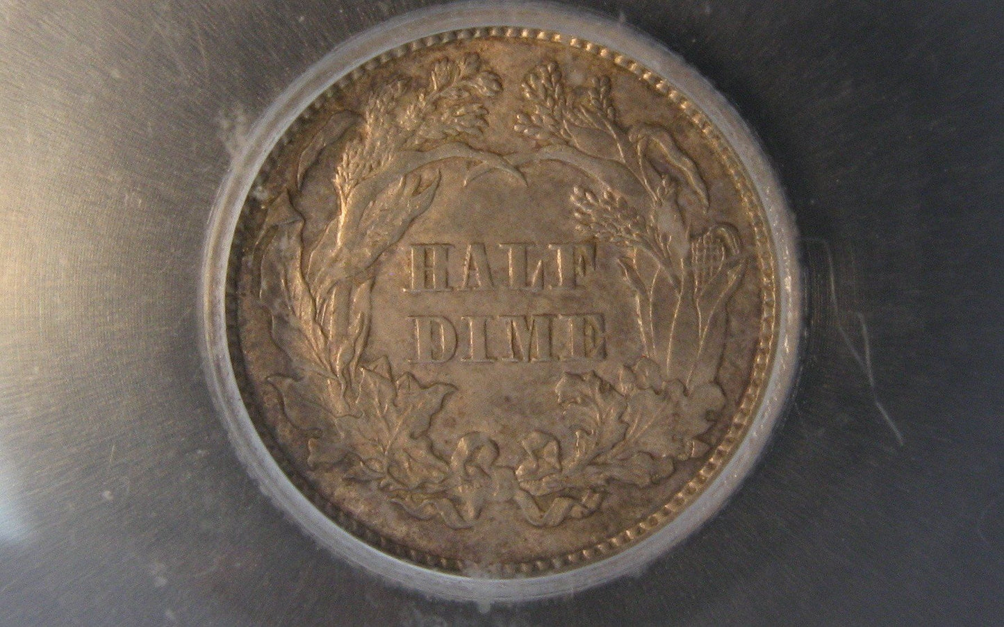 1870 Seated Liberty Half Dime.  ICG AU-55 | Of Coins & Crystals