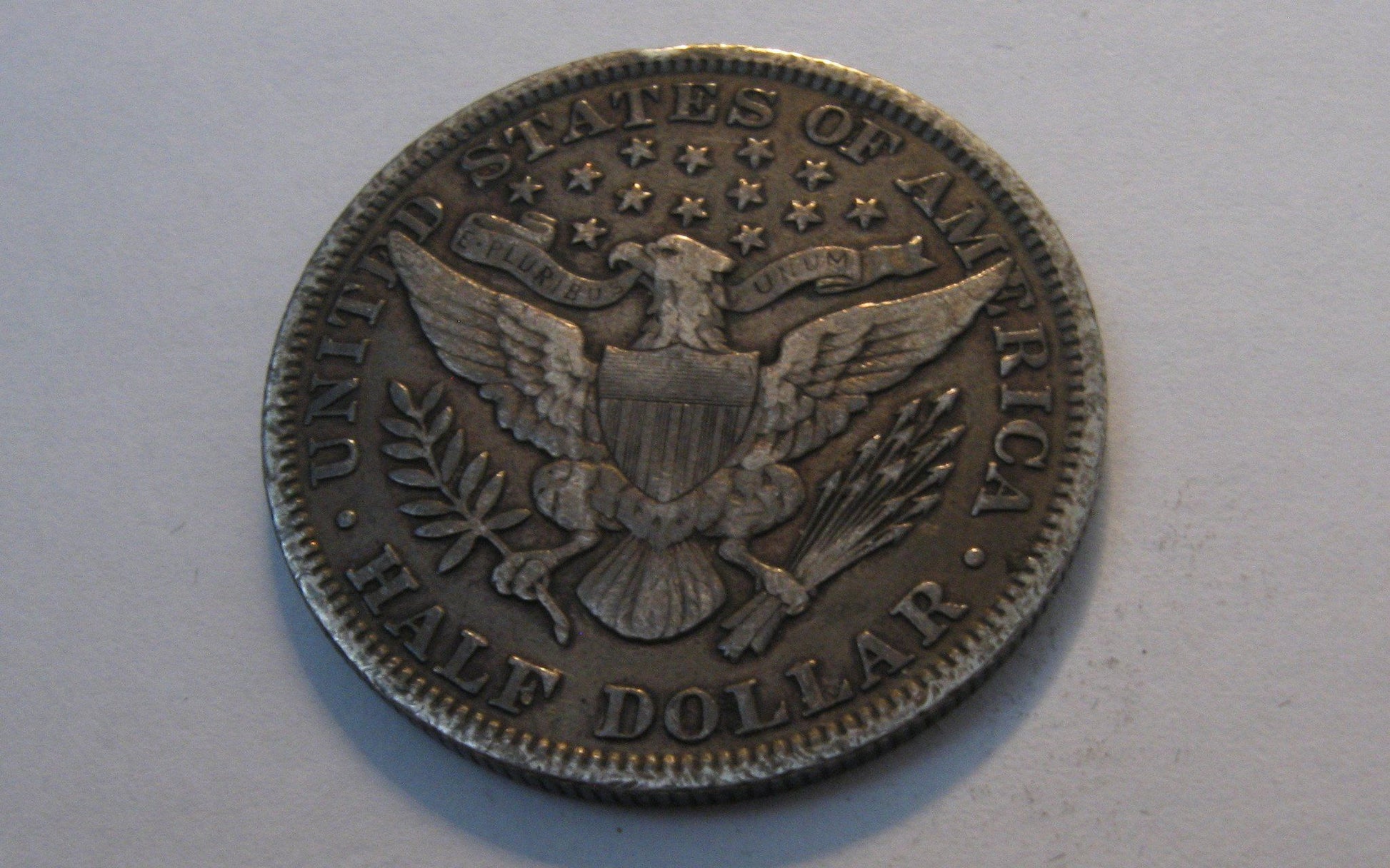 1899 Barber Half Dollar.  VF-20 | Of Coins & Crystals