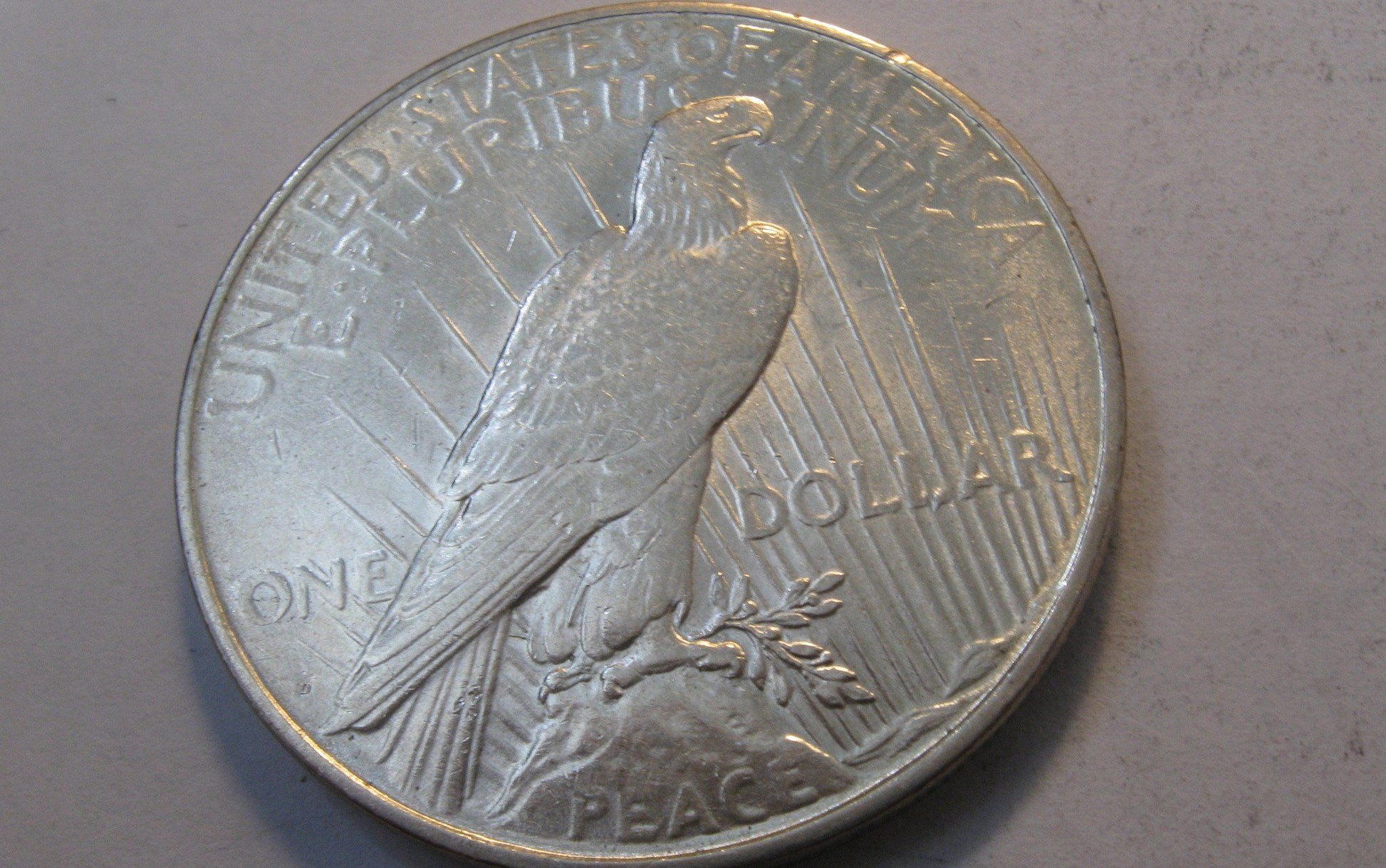 1927-D Peace Dollar.  AU-55 | Of Coins & Crystals